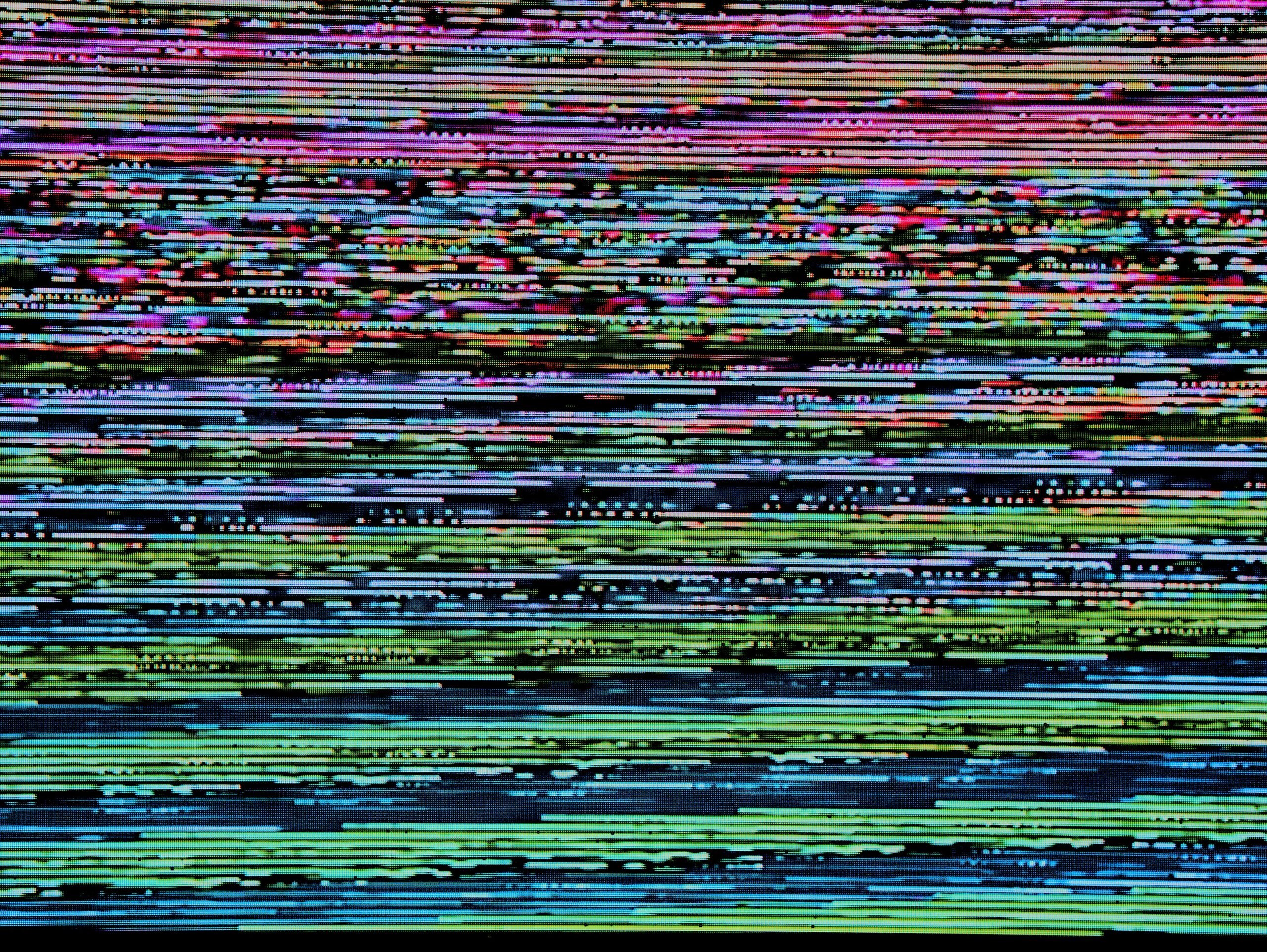 Colourful digital glitch pattern representing modern brain training and cognitive enhancement.