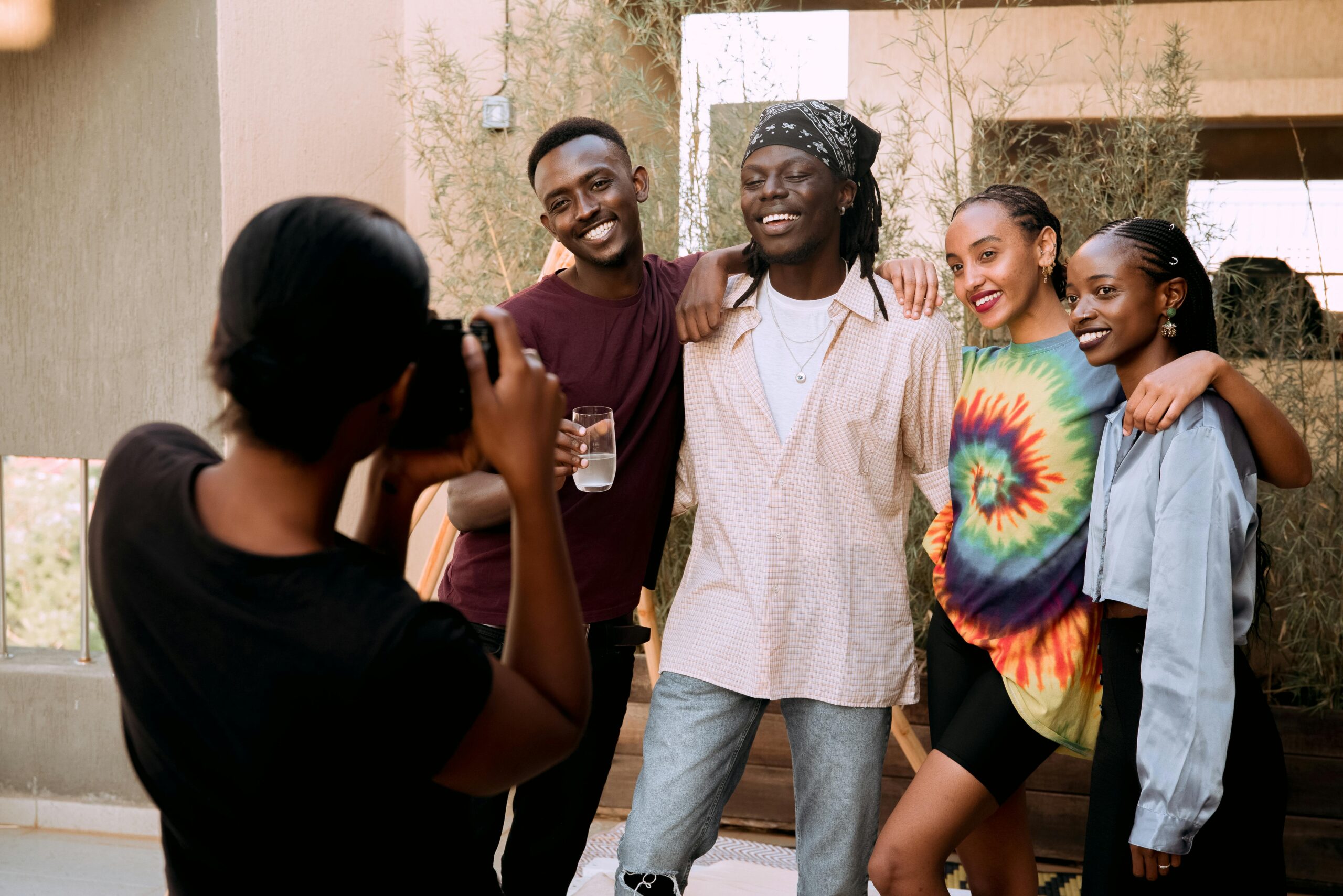 Group of diverse young professionals taking a photo together outdoors, illustrating team engagement and learning impact for L&D ROI.